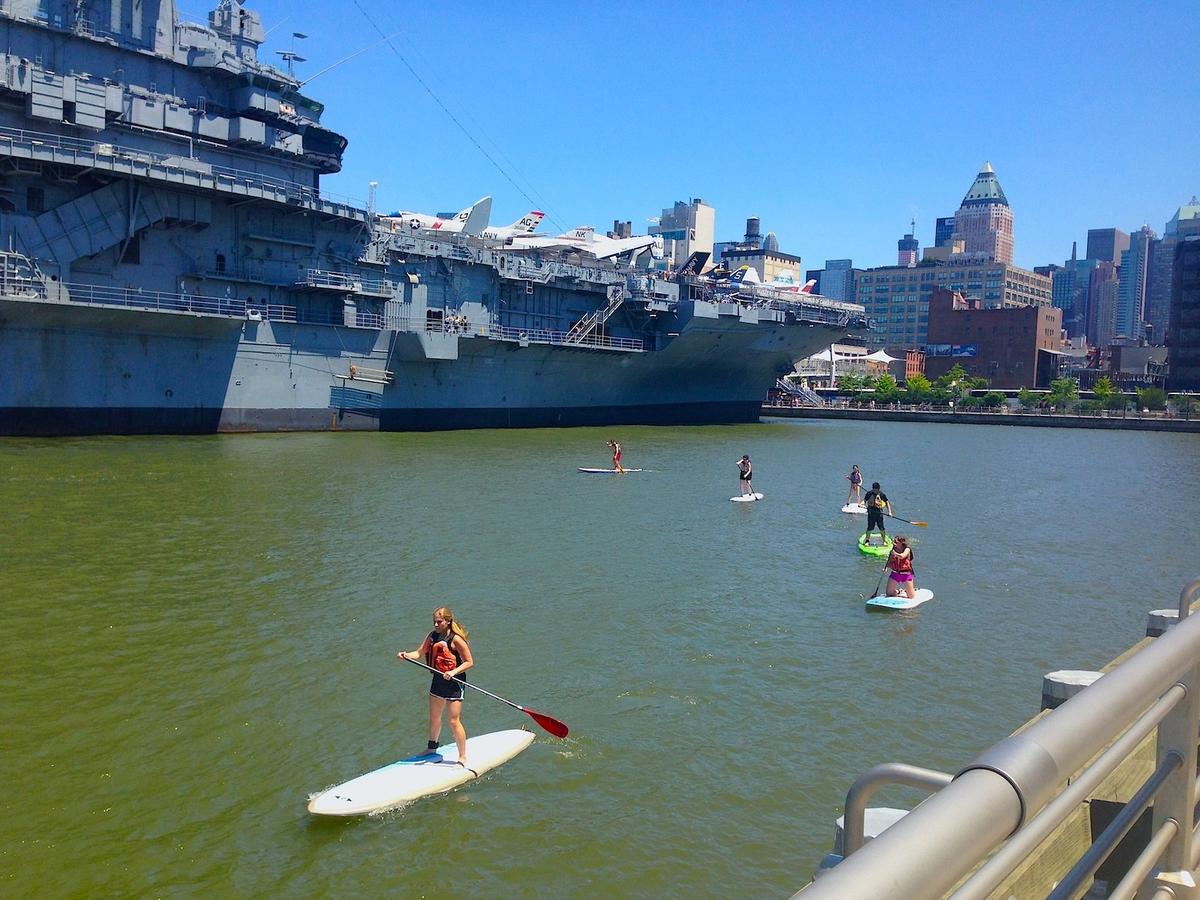Safety is a priority for Manhattan Kayak Co.'s paddleboarding activities, and the company provides all necessary equipment, including life jackets and high-quality paddleboards. (Courtesy of Manhattan Kayak Co.)