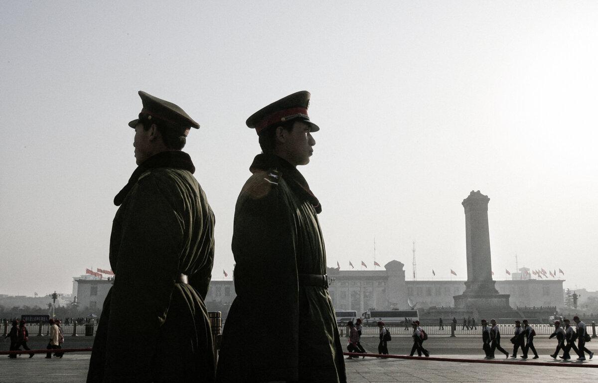 Paramilitary soldiers stand guard in front of the Great Hall of the People in Beijing on March 7, 2006. (Frederic J. Brown/AFP via Getty Images)