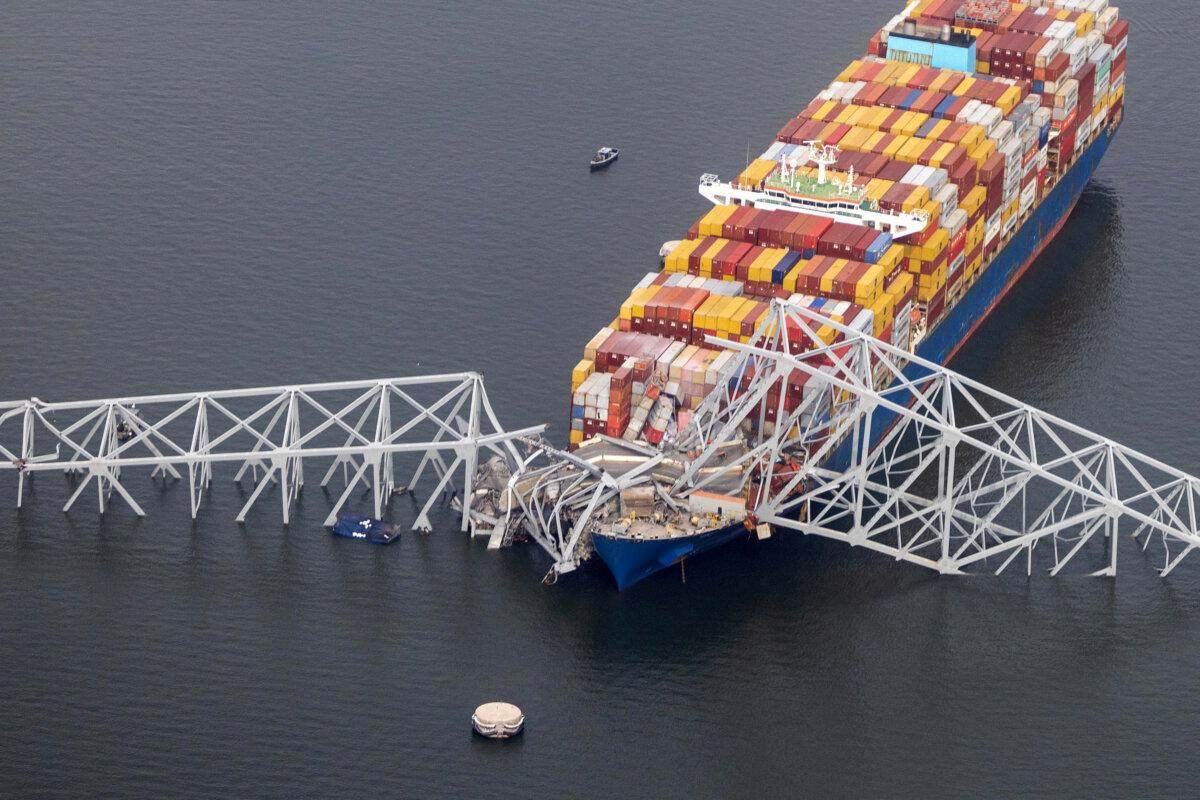 In an aerial view, the cargo ship Dali sits in the water after running into and collapsing the Francis Scott Key Bridge in Baltimore on March 26, 2024 (Tasos Katopodis/Getty Images)