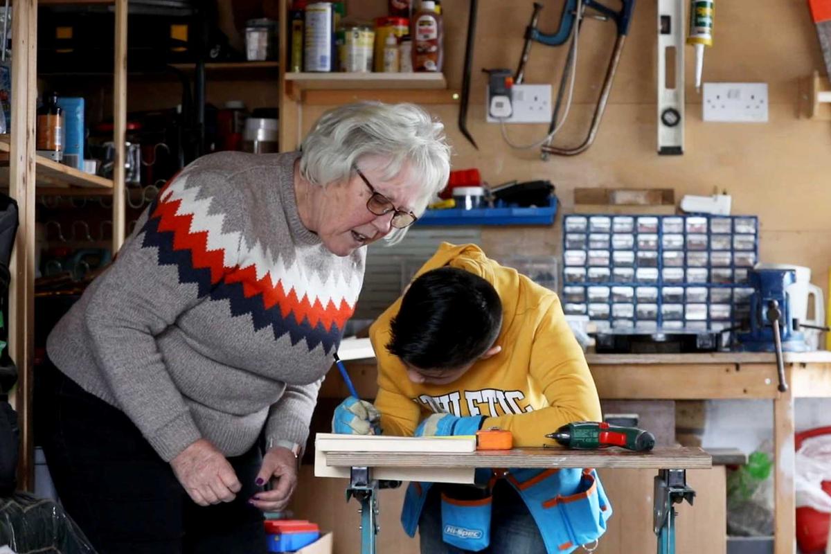 Ollie Ridley and his grandma, Ms. Sandra Ridley, collaborating on a carpentry project. (SWNS)