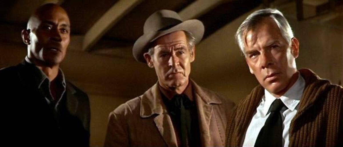 (L–R) Expert scout Jake (Woody Strode), rancher Ehrengard (Robert Ryan), and soldier Fardan (Lee Marvin), in “The Professionals.” (Columbia Pictures)