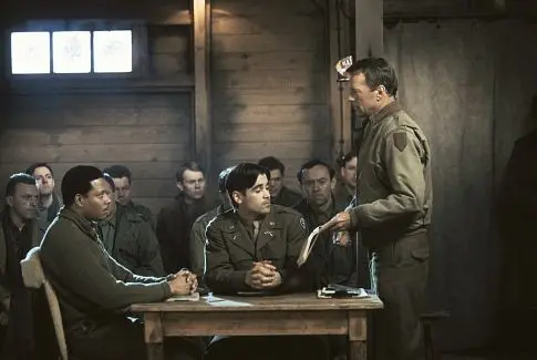 (L–R) Lt. Lincoln Scott (Terrence Howard) is court-martialed and defended by Lt. Thomas Hart (Colin Farrell), and judged by Col. William McNamara (Bruce Willis), in “Hart’s War.” (Metro-Goldwyn-Mayer)