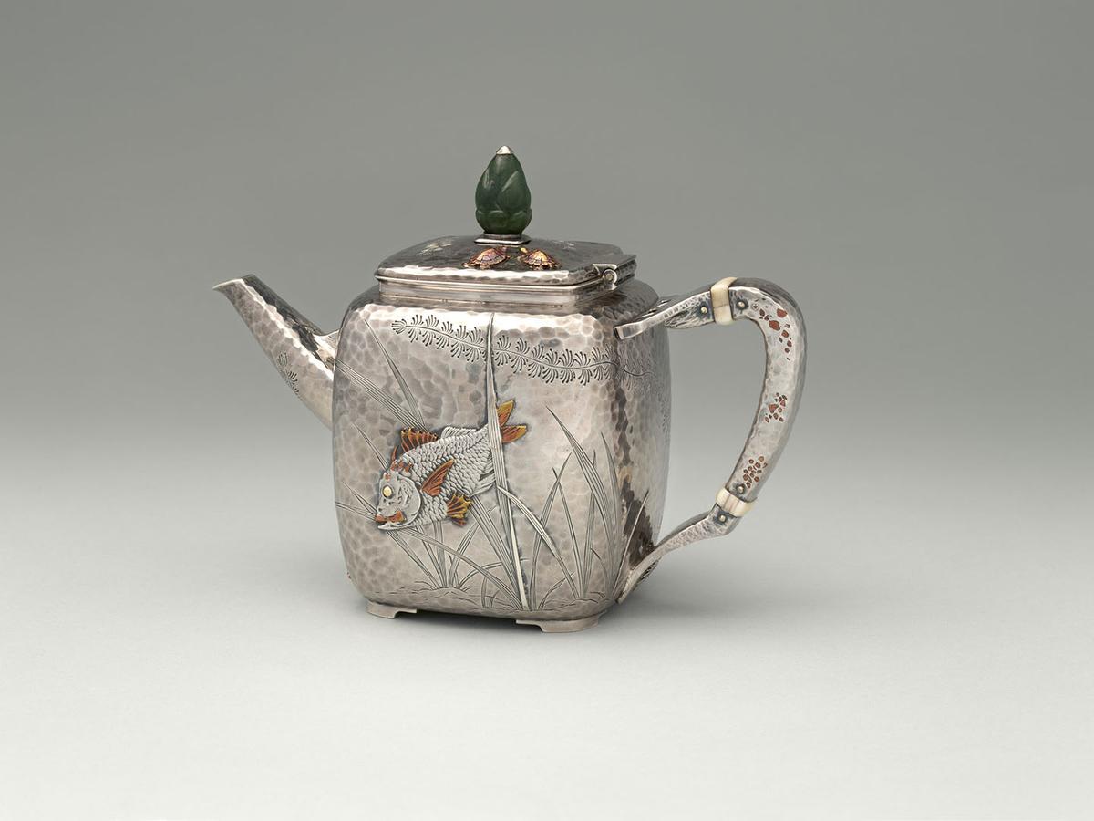 An American teapot, circa 1880, by Tiffany & Co. Silver, copper, ivory, and jade; 5 1/2 inches. The Metropolitan Museum of Art, New York City. (Public Domain)